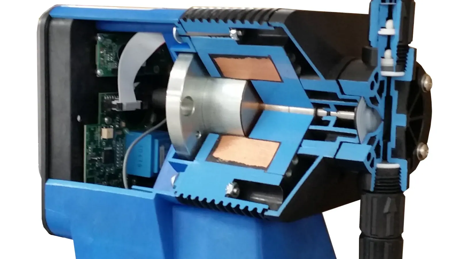 Cutaway view of a solenoid metering pump showing coil, armature and hydraulically actuated diaphragm